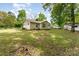Exterior backyard with a white painted brick house and a small white van at 627 Gray Dr, Charlotte, NC 28213