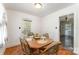 Cozy dining room featuring a wooden table with seating for four and hardwood floors at 627 Gray Dr, Charlotte, NC 28213