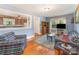 Bright living room with hardwood floors and an open view to the kitchen at 627 Gray Dr, Charlotte, NC 28213