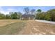 One-story home with a covered porch, neutral color palette and a large front yard at 6525 Kershaw Camden Hwy, Heath Springs, SC 29058