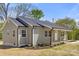 Charming one-story home with a covered porch, tidy landscaping and neutral color palette at 6525 Kershaw Camden Hwy, Heath Springs, SC 29058