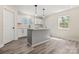 Bright kitchen showcases an island, modern appliances, and ample cabinet space, perfect for cooking at 6525 Kershaw Camden Hwy, Heath Springs, SC 29058