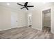 This main bedroom offers neutral walls, light wood-look floors and ensuite bathroom and walk-in closet at 6525 Kershaw Camden Hwy, Heath Springs, SC 29058