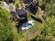 An aerial view showcases a private backyard oasis with pool, patio, hot tub, and lush landscaping at 712 Chase Ct, Fort Mill, SC 29708