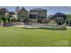 Expansive backyard with a pool, hot tub, outdoor seating, and a well-maintained lawn perfect for relaxation at 712 Chase Ct, Fort Mill, SC 29708