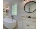 Beautiful bathroom featuring shiplap walls, a soaking tub, double vanity, and modern fixtures at 712 Chase Ct, Fort Mill, SC 29708