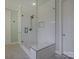 Bathroom shower with new tile work, glass surround, and built in bench at 712 Chase Ct, Fort Mill, SC 29708