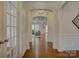 Spacious foyer with hardwood floors and arched doorways, leading to the living areas at 712 Chase Ct, Fort Mill, SC 29708