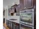 High-end kitchen features stainless steel appliances, gas cooktop, quartz counters and ample custom cabinets at 712 Chase Ct, Fort Mill, SC 29708