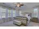Relaxing main bedroom with natural light and neutral tones, complemented by decorative pillows and window treatments at 712 Chase Ct, Fort Mill, SC 29708