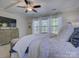 Bright main bedroom featuring tray ceilings, neutral colors, and great natural light at 712 Chase Ct, Fort Mill, SC 29708