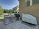 Stone outdoor kitchen with stainless steel appliances and a grill, perfect for entertaining and outdoor cooking at 712 Chase Ct, Fort Mill, SC 29708