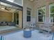 Covered patio with rocking chairs and comfortable seating, providing a relaxing space for enjoying the outdoors at 712 Chase Ct, Fort Mill, SC 29708