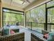 Relaxing screened porch with comfortable seating and a view of the backyard pool and lush greenery at 712 Chase Ct, Fort Mill, SC 29708