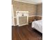 Bedroom area with decorative fireplace and hardwood floors at 8350 Nc Hwy 90 E Hwy, Stony Point, NC 28678