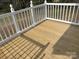 Spacious wooden deck with white railings, perfect for outdoor entertaining and enjoying the view at 8350 Nc Hwy 90 E Hwy, Stony Point, NC 28678