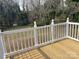 Outdoor wooden deck with white railings offering backyard views and a great outdoor living space at 8350 Nc Hwy 90 E Hwy, Stony Point, NC 28678