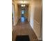 Bright hallway with classic trim, leading to multiple rooms, featuring hardwood floors and vintage charm at 8350 Nc Hwy 90 E Hwy, Stony Point, NC 28678