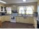 Well-lit kitchen featuring ample counter space and matching appliances at 8350 Nc Hwy 90 E Hwy, Stony Point, NC 28678