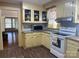 Kitchen with an opening to the Living Room featuring ample counter space and matching appliances at 8350 Nc Hwy 90 E Hwy, Stony Point, NC 28678
