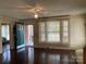 Inviting living room with hardwood floors, a front door view and large windows at 8350 Nc Hwy 90 E Hwy, Stony Point, NC 28678