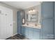 Bathroom featuring a double vanity, ample storage, and modern fixtures at 8917 Chalkstone Rd, Charlotte, NC 28216