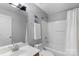 Well-lit bathroom featuring a shower-tub combo, vanity, and modern fixtures for convenience at 8917 Chalkstone Rd, Charlotte, NC 28216
