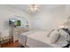 Cozy bedroom featuring a large dresser, a comfortable bed, and a bright, airy atmosphere at 8917 Chalkstone Rd, Charlotte, NC 28216