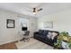 Inviting bedroom with a comfortable sofa, work area, and a relaxing atmosphere, perfect for unwinding at 8917 Chalkstone Rd, Charlotte, NC 28216