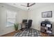 Well-lit room with modern ceiling fan, a work space, and stylish decor for comfortable living at 8917 Chalkstone Rd, Charlotte, NC 28216