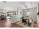 Light and airy dining room with modern chandelier, table, and seating, located near the living room at 8917 Chalkstone Rd, Charlotte, NC 28216