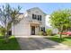 Well-maintained two-story home with attached garage and a well-manicured front yard at 8917 Chalkstone Rd, Charlotte, NC 28216