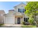 Charming home with front garden, covered porch, and an attached one car garage at 8917 Chalkstone Rd, Charlotte, NC 28216