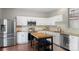 Stylish kitchen with stainless steel appliances, white cabinets, and a butcher block island at 8917 Chalkstone Rd, Charlotte, NC 28216
