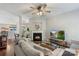 Inviting living room with a fireplace, ceiling fan, and comfortable seating area at 8917 Chalkstone Rd, Charlotte, NC 28216
