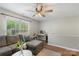 Comfortable living room with a large sectional, a ceiling fan, and view of the loft at 8917 Chalkstone Rd, Charlotte, NC 28216