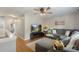 Spacious living room with hardwood floors, a large sectional, and a modern entertainment center at 8917 Chalkstone Rd, Charlotte, NC 28216