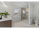 Bright bathroom featuring a glass-enclosed shower, sleek fixtures, and a decorative plant by the vanity at 9913 Jack Nicklaus Dr # 908, Lancaster, SC 29720