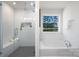 Elegant bathroom featuring a soaking tub and a glass-enclosed shower with beautiful tile work at 9913 Jack Nicklaus Dr # 908, Lancaster, SC 29720