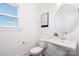 Clean half-bathroom featuring a pedestal sink, modern fixtures, and natural light at 9913 Jack Nicklaus Dr # 908, Lancaster, SC 29720