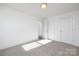 Clean, empty bedroom with plush carpet and a doorway, ready for personalization at 9913 Jack Nicklaus Dr # 908, Lancaster, SC 29720