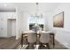 Bright dining room features a modern chandelier, natural light and neutral decor at 9913 Jack Nicklaus Dr # 908, Lancaster, SC 29720
