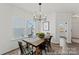 Cozy dining area with a modern chandelier and a view of the backyard at 9913 Jack Nicklaus Dr # 908, Lancaster, SC 29720