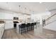 Bright, modern kitchen with white cabinets, quartz countertops, pendant lighting, and bar stool seating at 9913 Jack Nicklaus Dr # 908, Lancaster, SC 29720