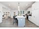 Bright kitchen with white cabinets, quartz countertops, and a large center island with bar stool seating at 9913 Jack Nicklaus Dr # 908, Lancaster, SC 29720