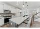 Bright kitchen features a center island, stainless appliances, and ample cabinet space at 9913 Jack Nicklaus Dr # 908, Lancaster, SC 29720