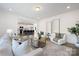 Spacious living room open to the kitchen, featuring a round coffee table and neutral tones at 9913 Jack Nicklaus Dr # 908, Lancaster, SC 29720