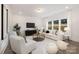 Inviting living room with plush white furniture, a large window, and modern decor at 9913 Jack Nicklaus Dr # 908, Lancaster, SC 29720