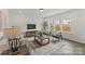 Bright living room featuring hardwood floors and neutral decor for a relaxing atmosphere at 9913 Jack Nicklaus Dr # 908, Lancaster, SC 29720