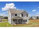 Two-story home with a screened porch, backyard lawn and landscaping at 9913 Jack Nicklaus Dr # 908, Lancaster, SC 29720